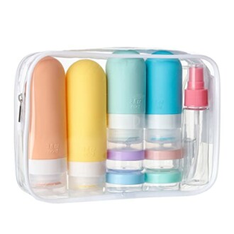 Clear travel bag with assorted toiletry bottles and containers.